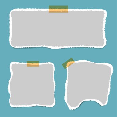 Boş kare not defteri sayfaları ve teyp. Not kağıdı bej yapışkan bant ile sıkışmış.