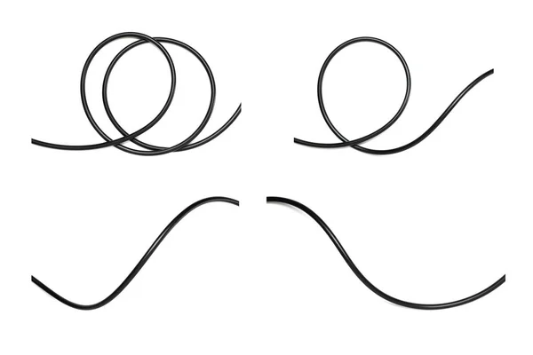 Un cavo di filo nero isolato su uno sfondo bianco astrazione . — Foto Stock