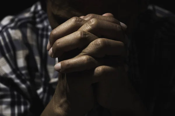 Hand of man while praying for religion. Concept peace and life. — Stock Photo, Image