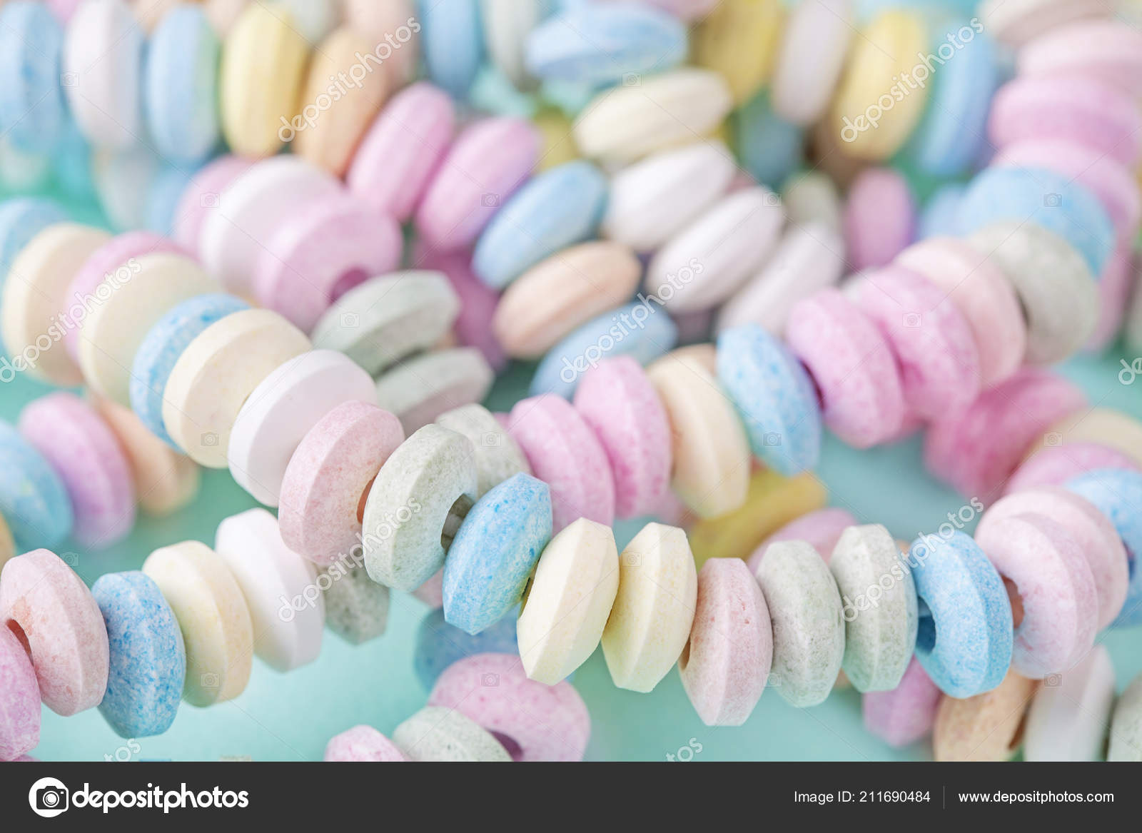 Candy Necklace Blue Pastel Colored Background Stock Photo by ©Elena  Schweitzer 211690484