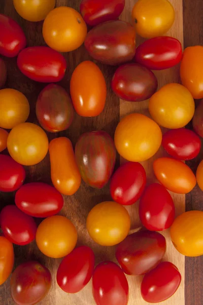 Bio Colored Tomato Mix Wooden Board Royalty Free Stock Images