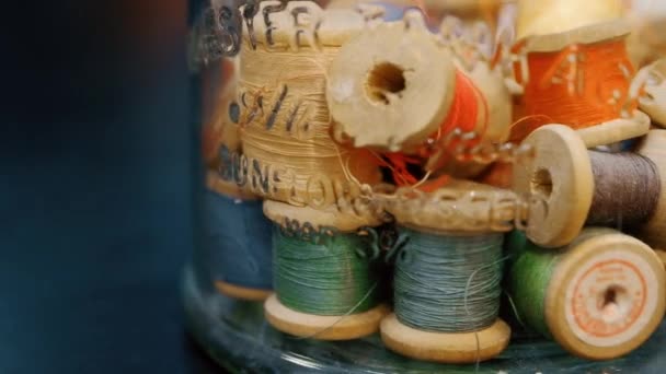 Closeup dolly shot of thread spools — Stock Video