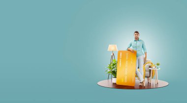 Evinde kredi kartıyla gülümseyen genç bir adam. Çevrimiçi ödeme kavramı. Alışılmadık 3d illüstrasyon