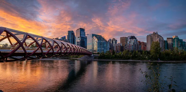 View of pedestrian bridge over the Bow River in Calgary Alberta at sunrise.