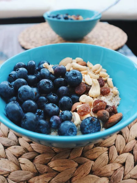 Close Oatmeal Blueberry Nuts Blue Dish — Stock Photo, Image