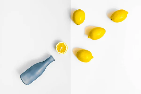 Water Bottle Few Lemons Pastel Grey White Background Flat Lay — Stock Photo, Image