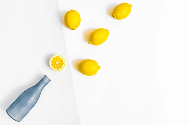 Water Bottle Few Lemons Pastel Grey White Background Flat Lay — Stock Photo, Image