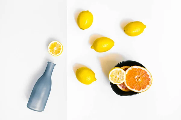 Water Bottle Few Lemons Pastel Grey White Background Flat Lay — Stock Photo, Image