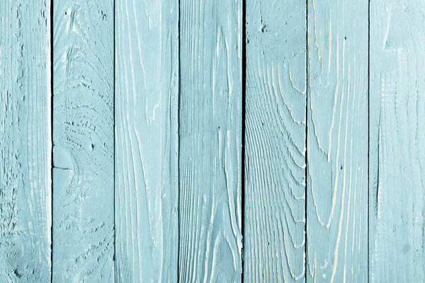top view of light blue wooden background with vertical planks 