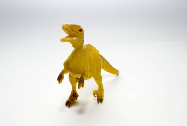 oyuncak dinozor velociraptor beyaz bir arka plan üzerinde