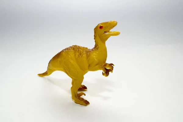 toy dinosaur velociraptor on a white background