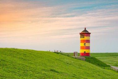 Beautiful lighthouse on the East Frisian coast clipart