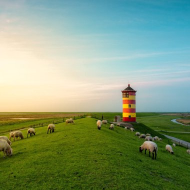 beautiful lighthouse on the East Frisian coast clipart