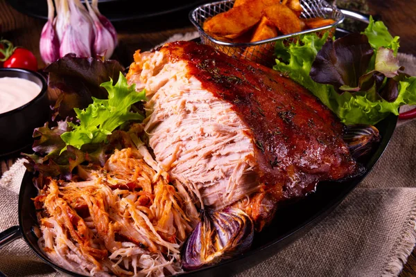 Delicious pulled pork with baked potato quarters — Stock Photo, Image