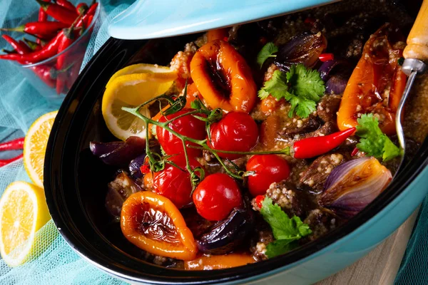 Tasty spicy beef with various vegetables cooked in tagine — Stock Photo, Image