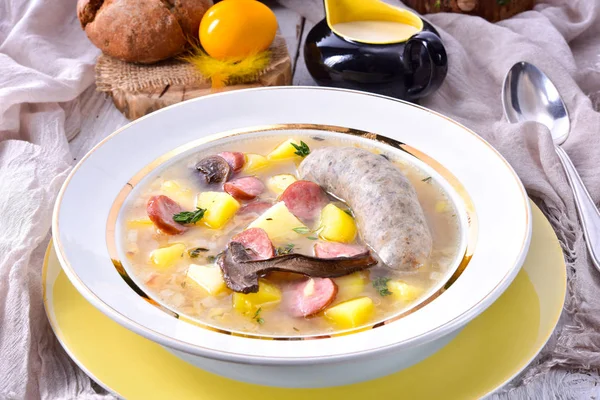 A polish easter soup with homemade white sausage and mushrooms — Stock Image A polish easter soup with homemade white sausage and mushrooms Stock Picture