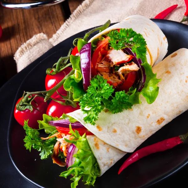 Tasty wraps filled with pulled pork and salad — Stock Photo, Image