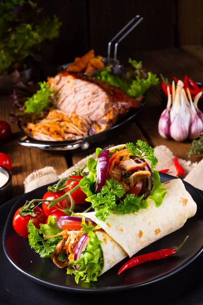 Tasty wraps filled with pulled pork and salad — Stock Photo, Image
