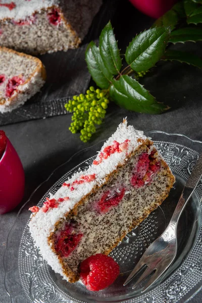 Poppy seed cake with raspberries and grated coconut — Stock Photo, Image