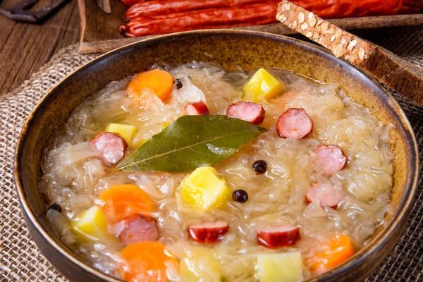 Rustic sauerkraut soup with bacon and sausage — Stock Image Rustic sauerkraut soup with bacon and sausage Stock Image