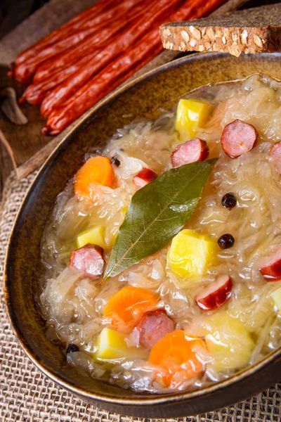 Rustic sauerkraut soup with bacon and sausage — Stock Image Rustic sauerkraut soup with bacon and sausage Stock Image
