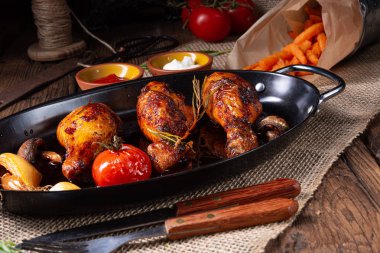 grilled chicken legs in barbecue marinade with sweet potatoes clipart