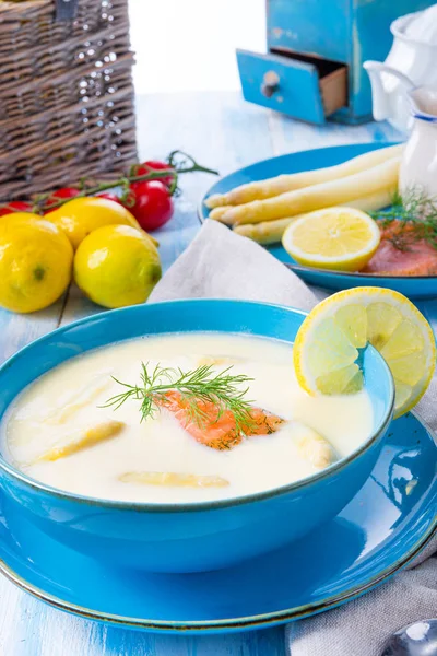 Cream of asparagus soup with salmon rolls and dill — Stock Image Cream of asparagus soup with salmon rolls and dill Royalty Free Stock Images
