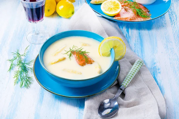 Cream of asparagus soup with salmon rolls and dill — Stock Image Cream of asparagus soup with salmon rolls and dill Stock Photo