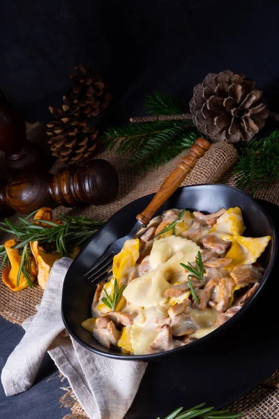 Colorful farfalle pasta with chanterelles and cream sauce. — Stock Photo, Image