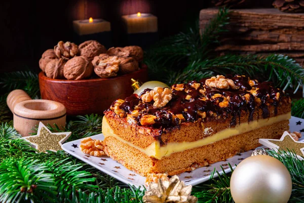 Chocolate gingerbread with filling, jam and nuts — Stock Photo, Image