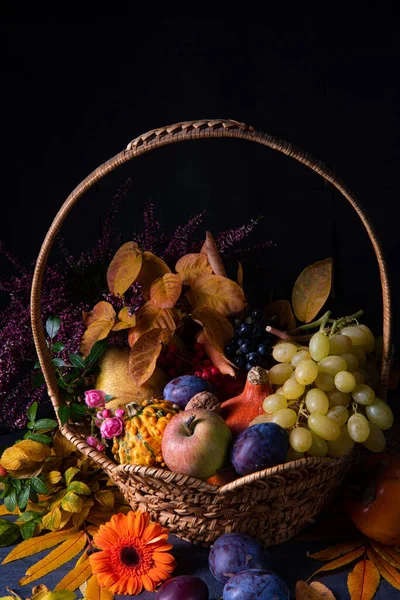 Autumnal cornucopia in round basket — Stock Photo, Image