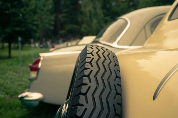 Yellow vintage cars on the grass — Stock Photo, Image