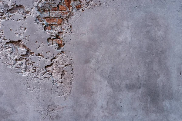 Textured wall with fragments of old red bricks — Stock Photo, Image