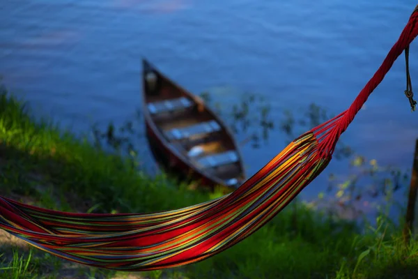 Hammock on the background of a boat on the river in summer — Stock Photo, Image