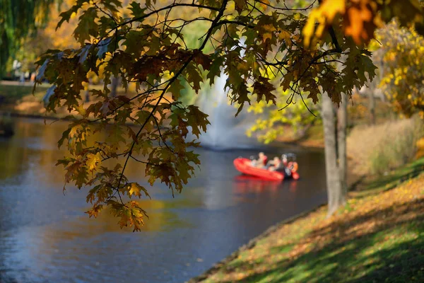 Boat on the city canal in Riga in autumn — Stock Photo, Image