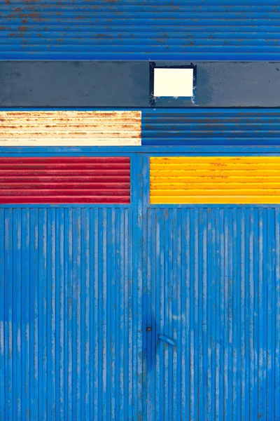 Iron metal gate with colored painted rectangles — Stock Photo, Image