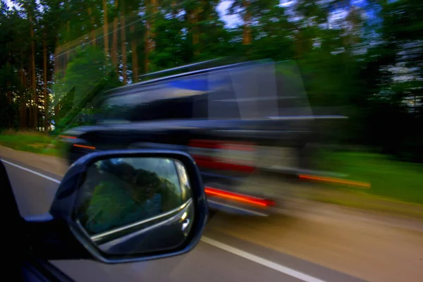 Overtaking a car at high speed in summer — Stock Photo, Image