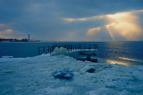 Pier frozen in ice in the river in winter — Stock Photo, Image