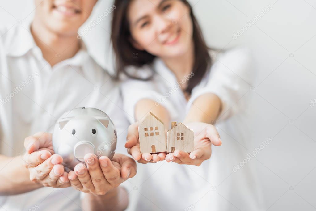 Couple saving money for buying new house concept