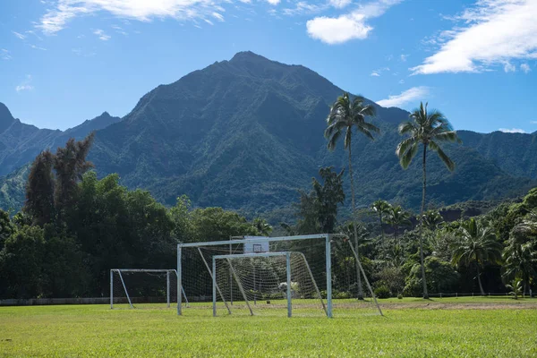 Football school soccer field on a tropical island near the mountains
