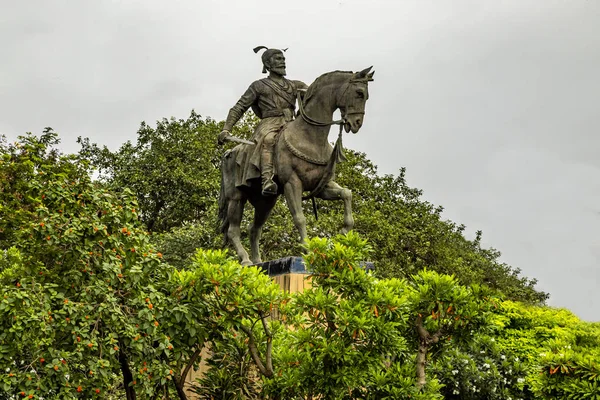 Statue of King Shivaji,Statue of Chhatrapati Shivaji Maharaj in Mumbai Opp Gateway of India , Maharashtra, India with the monsoon clouds in background.