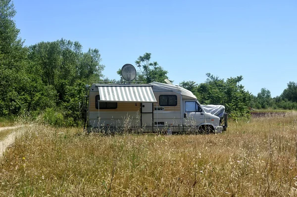 Camping car installed in the middle of the fields