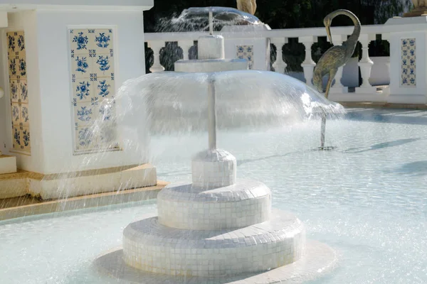 Water fountains inside basin with beautiful statues (stream of clear water from a fountains, white splashes of water, isometric view)