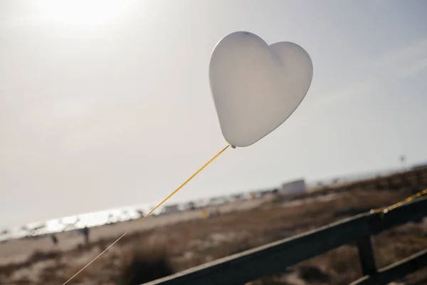 White Air Balloons heart shaped flying in blue sky. Love concept. Holiday celebration. — Stock Photo, Image