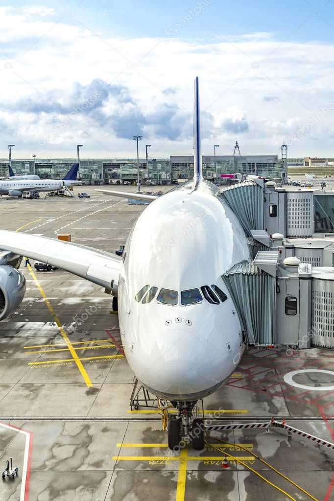 Loading of a big passenger aircraft at the gate without logos