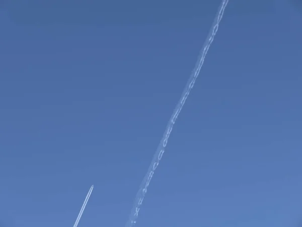 Aircraft with contrail — Stock Photo, Image
