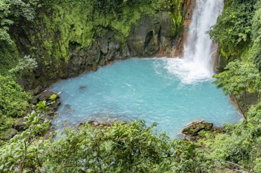 scenic waterfall in tenorio volcano national park clipart