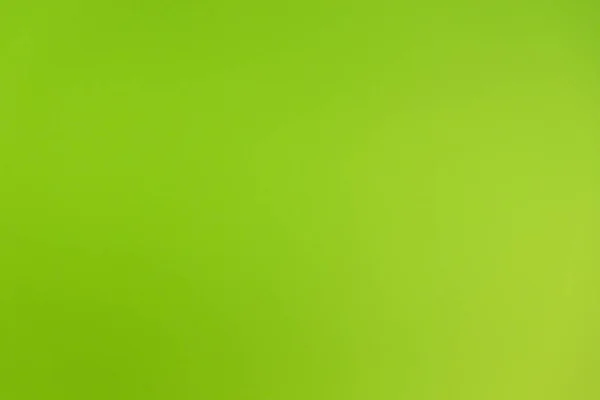 Fundo verde neon intensivo em uma parede — Fotografia de Stock