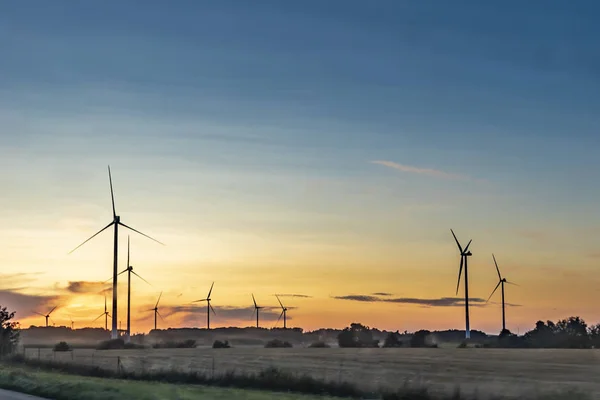 Electric wind generators in sunset — Stock Photo, Image