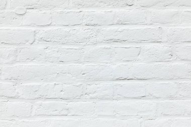 Ahenkli arkaplan olarak beyaza boyanmış eski beyaz tuğla duvar